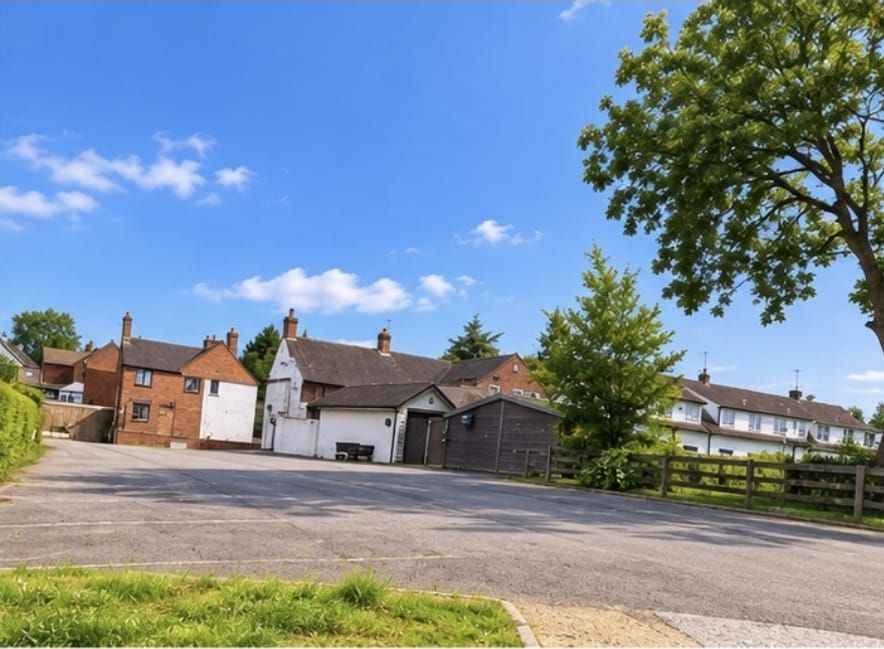 The Nags Head seen from the road, with the car park in front